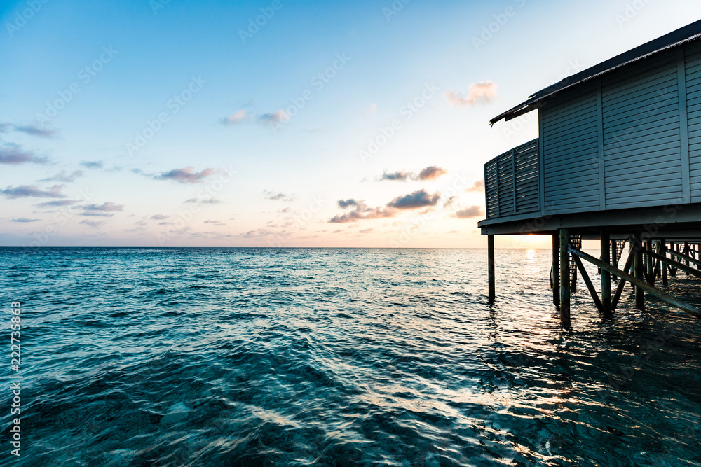Beautiful luxury villas over water on tropical island resort in Maldives with turquoise sea and sunset,Vacation Destination in holiday relax with nature in summer Beautiful luxury villas over water on tropical island resort in Maldives with turquoise sea and sunset,Vacation Destination in holiday relax with nature in summer