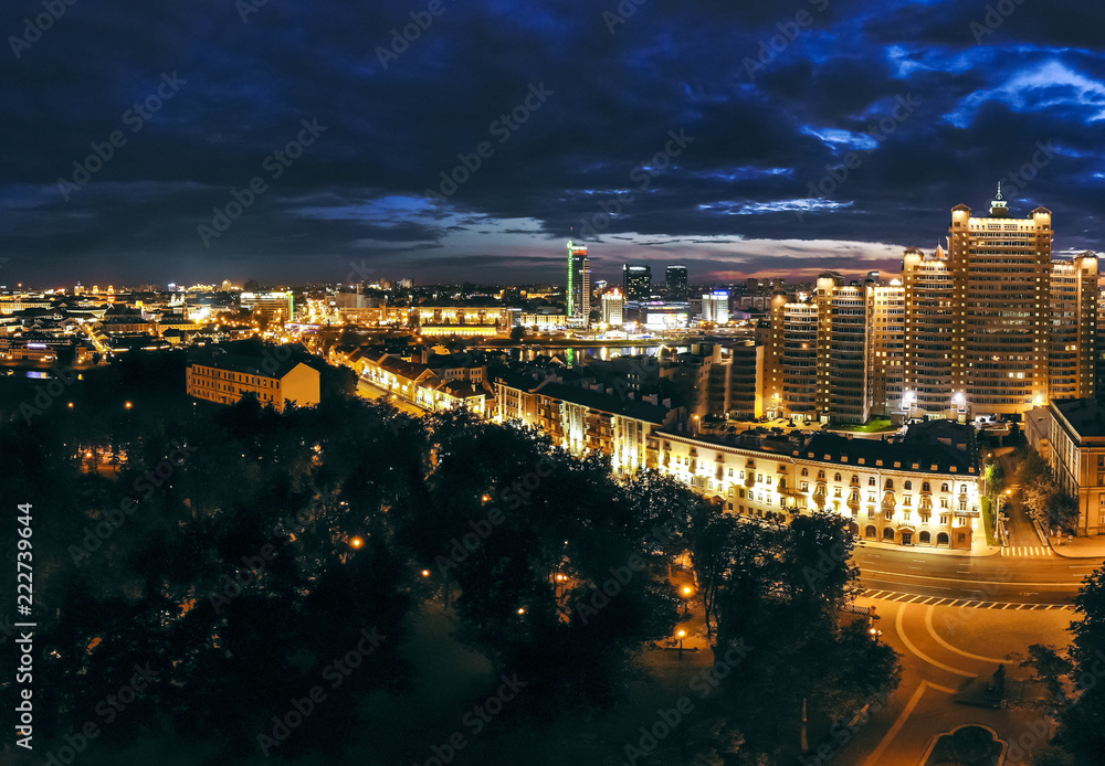 Aerial panorama view of night city buildings with bright street lights. Minsk, Belarus
