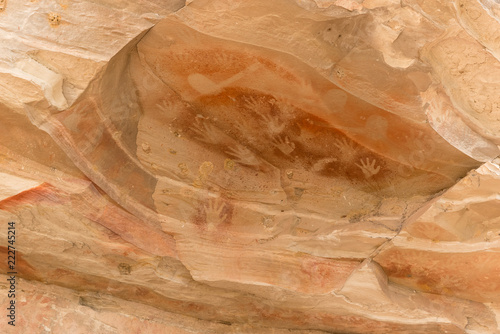 Aboriginal stencil rock art of hands and stone axe at Baloon Cave, Carnarvon Gorge, Queensland, Australia.