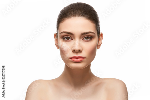 girl applying powder on face isolated on white