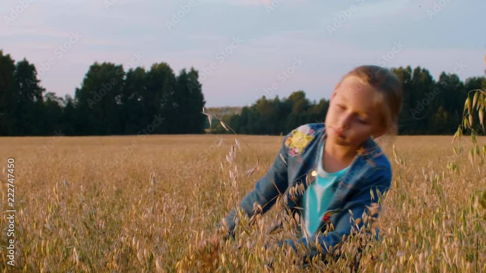 Cute teenager girl touching of hands wheat on field and funny dancing Cute teenager girl touching of hands wheat on field and funny dancing