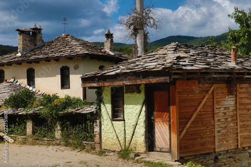 Old houses in the historical cultural reserve village of Dolen, Bulgaria. Dolen is famous with its 350 old houses – an example of 19th century Rhodopean architecture. photo