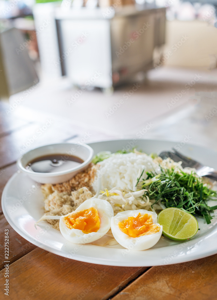 sweet and sour with rice, vegetable ,herbs and egg salad Thai southern style /Nasi Kerabu (Kao Yum)