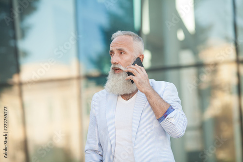 Senior Man Mobile Phone Communication Connection Technology Concept © lashkhidzetim