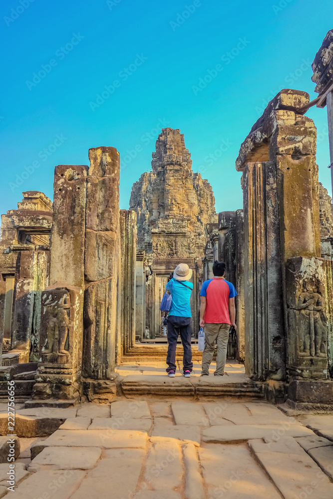 Couple stand infront of bayon temple siem reap cambodia,wonder of the world,travel concept.