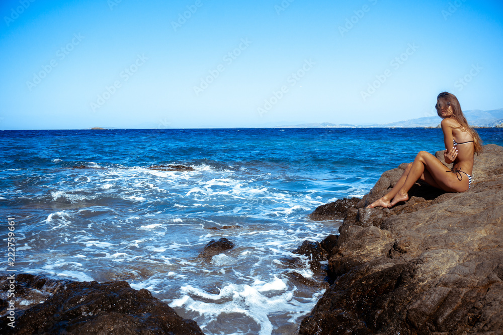 sexy girl in a stunning blue sea sexy girl in a stunning blue sea