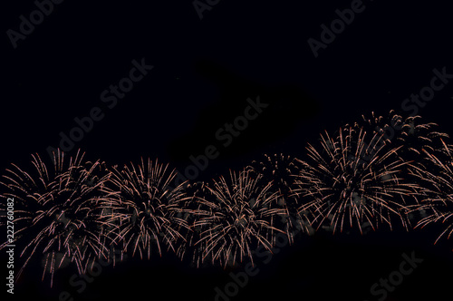 Fireworks abstract holiday background. Copy space.