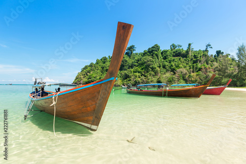 White sand beach and Long-tail boat at Kham-Tok Island (koh-kam-tok), The beautiful sea Ranong Province, Thailand. © PRASERT