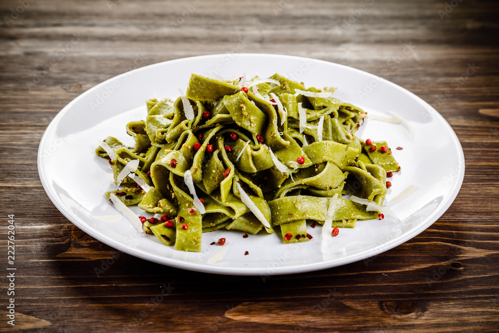Pasta with cheese on wooden table Pasta with cheese on wooden table