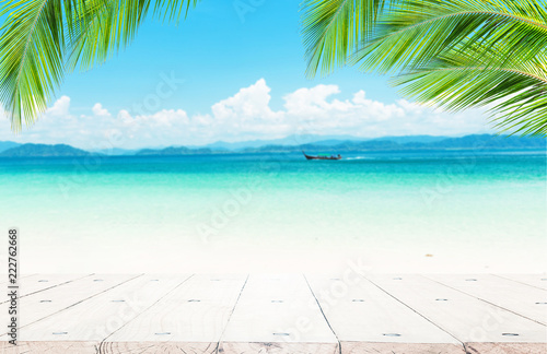 Blue sea background with wood floor foreground for display text or products