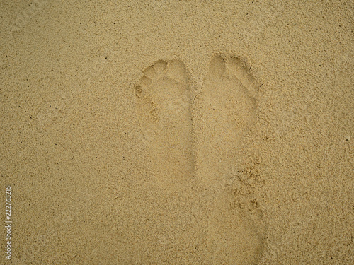 Footprint on the tropical beach in vacation time