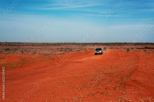 4wd off road van on red soil Outback Australia photo