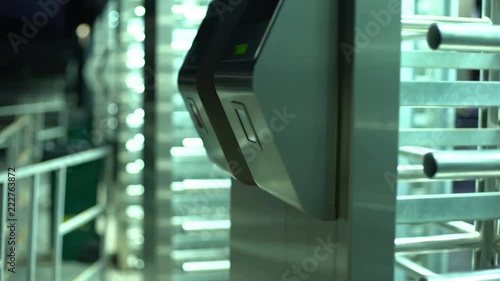 Woman passing electronic turnstile, access control for business center, closeup photo