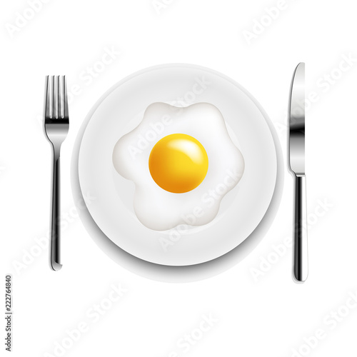 Plate With Fried Eggs Fork And Knife White Background