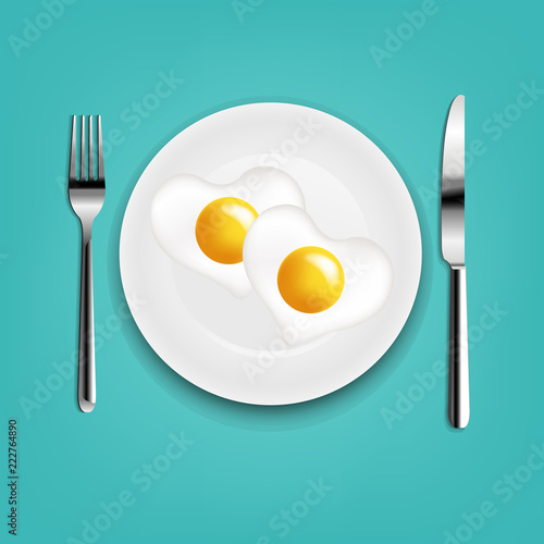 Plate With Fried Eggs Heart Fork And Knife With Mint Cloth