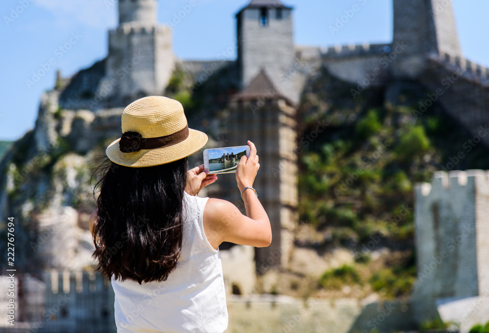 Tourist taking photo at Golubac fortress in Serbia