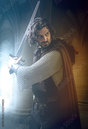 Kinght holding a sword in a castle, photo manipulation  photo