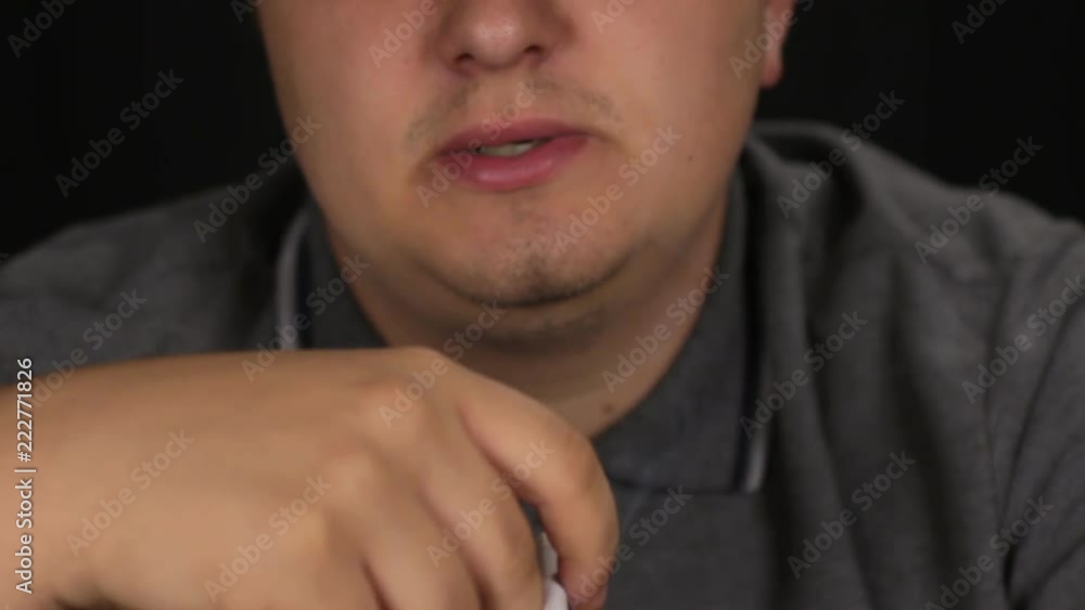 Close-up. Man is smoking a cigarette. Close-up. Man is smoking a cigarette.
