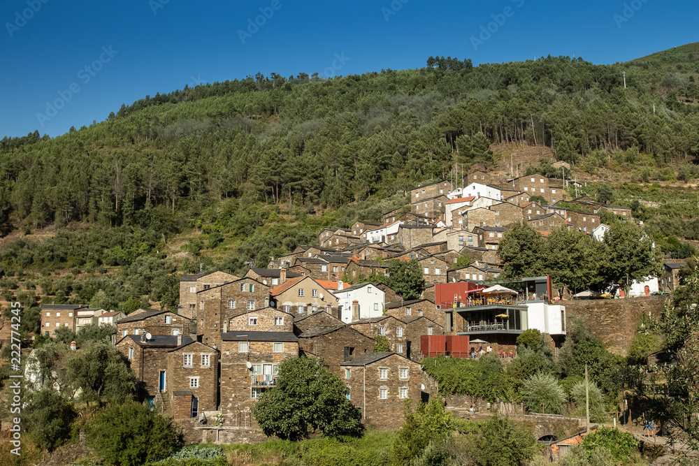 The beautiful schist village of Piodão seen from the opposite hillside on a clear sunny day