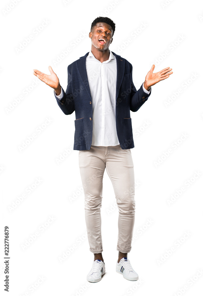Full body of Handsome african american man wearing a jacket with surprise and shocked facial expression on white background Full body of Handsome african american man wearing a jacket with surprise and shocked facial expression on white background
