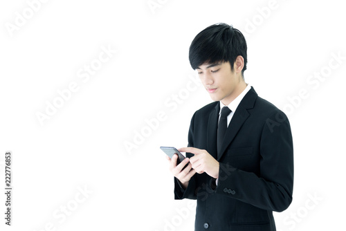 Asia businessman with black suit and black necktie has using phone isolated on white background.