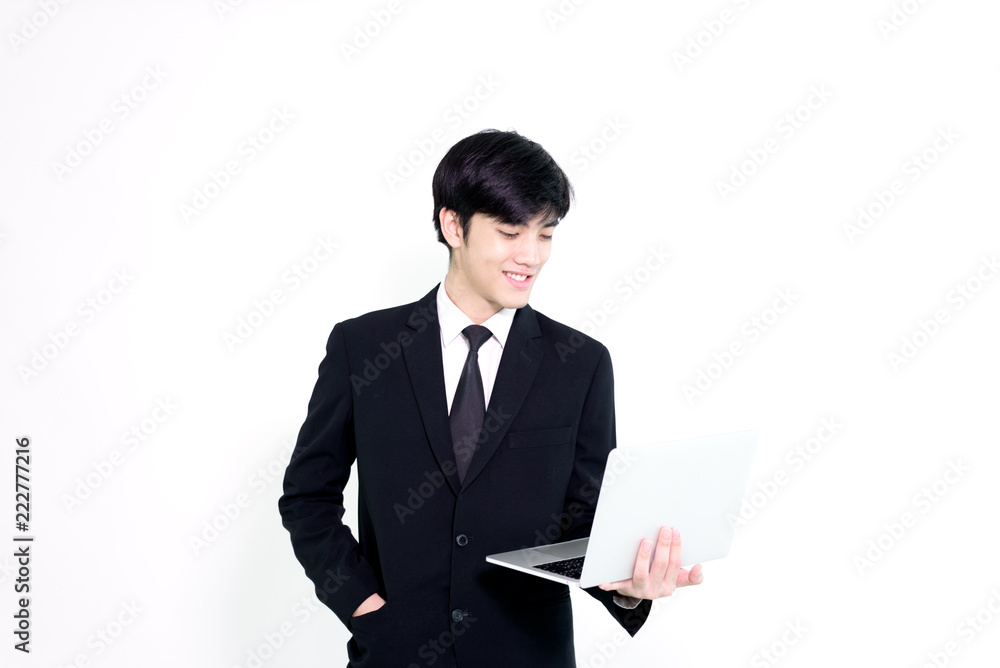 Asian business handsome man has holding laptop for woking with happy and relaxing isolated on white background. Asian business handsome man has holding laptop for woking with happy and relaxing isolated on white background.