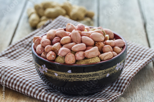 beans in cup on wooden table.