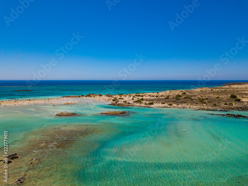 Aerial view to the beautiful beach and island of Elafonisi lagoon. Amazing wallpaper, photo from drone. Crete, Greece. © umike_foto