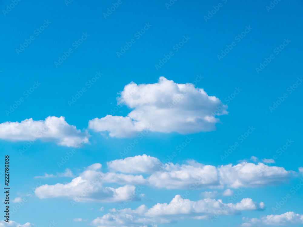 Fototapeta premium Light in the clouds on blue sky, The stormy and fluffy clouds shined from above with the sunlight, view from airplane Windows.
