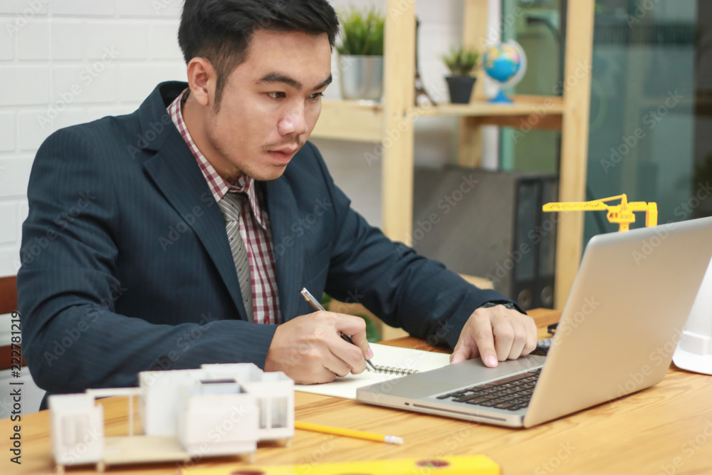 Engineer using calculator and laptop for calculating finance on desk office. investment financial accounting concept. Engineer using calculator and laptop for calculating finance on desk office. investment financial accounting concept.