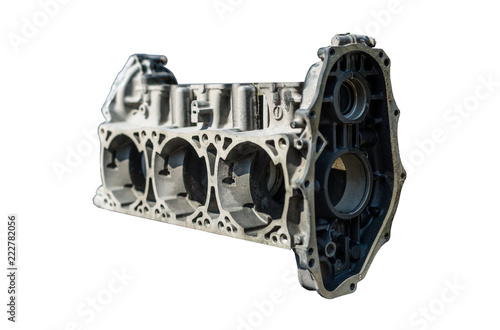 A disassembled of a three-cylinder engine block isolated on a white background with a clipping path. photo