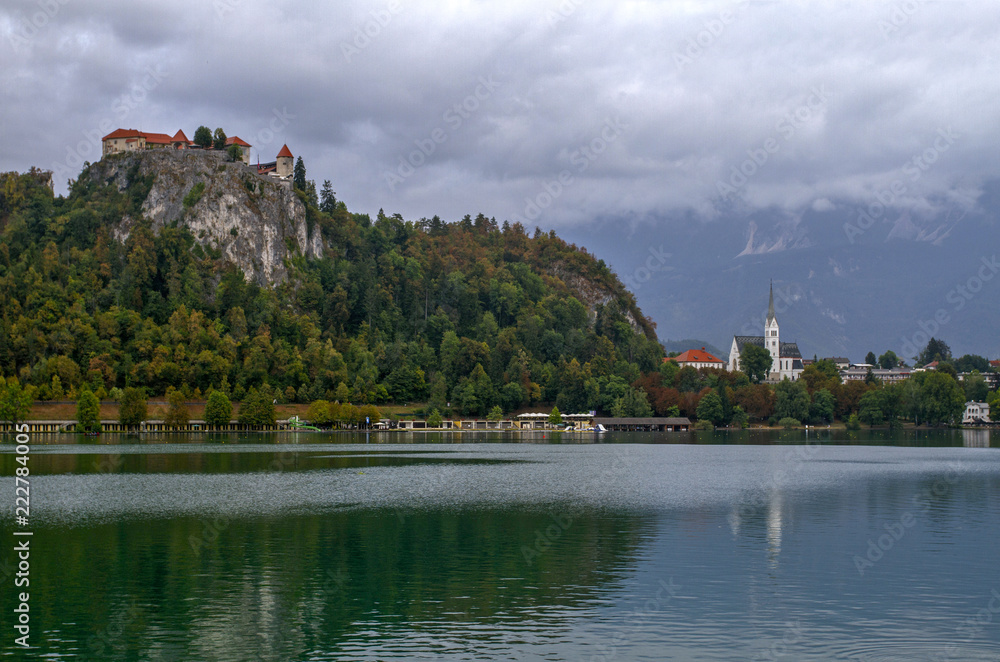 Medieval castle Bled  on Lake Bled in Slovenia is the oldest medieval town in Slovenia . Mountains in background. Slovenia, Europe. European travel.