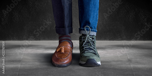 Work Life Balance Concept. Low Section of a Man Standing with Half of Working Shoes and Casual Traveling Shoes photo