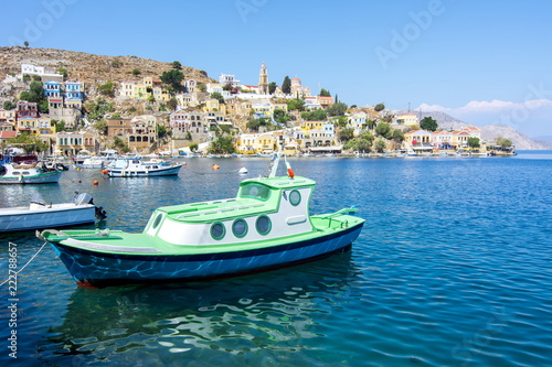 Boat in Symi town harbor, Dodecanese islands, Greece