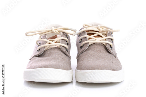 Close up of kids sneakers on white background © lalalululala