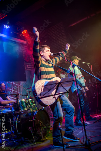 Band performs on stage in a nightclub