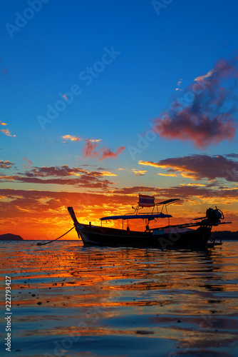 Rawai beach with andaman long tailed boat southern of thailand on clear sea water with sun shine in phuket