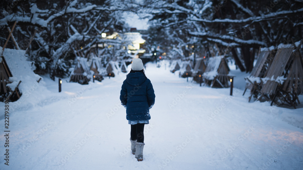 Asian girl walking in the park in the winter  night,Aomori Japan