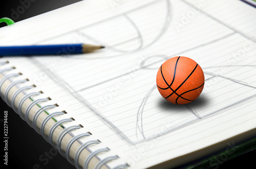 Basketball is on the stadium to draw into the book.The concept represents a dream come true © khampiranon