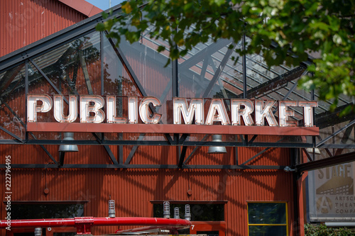 Public market neon sign in the street under the sun