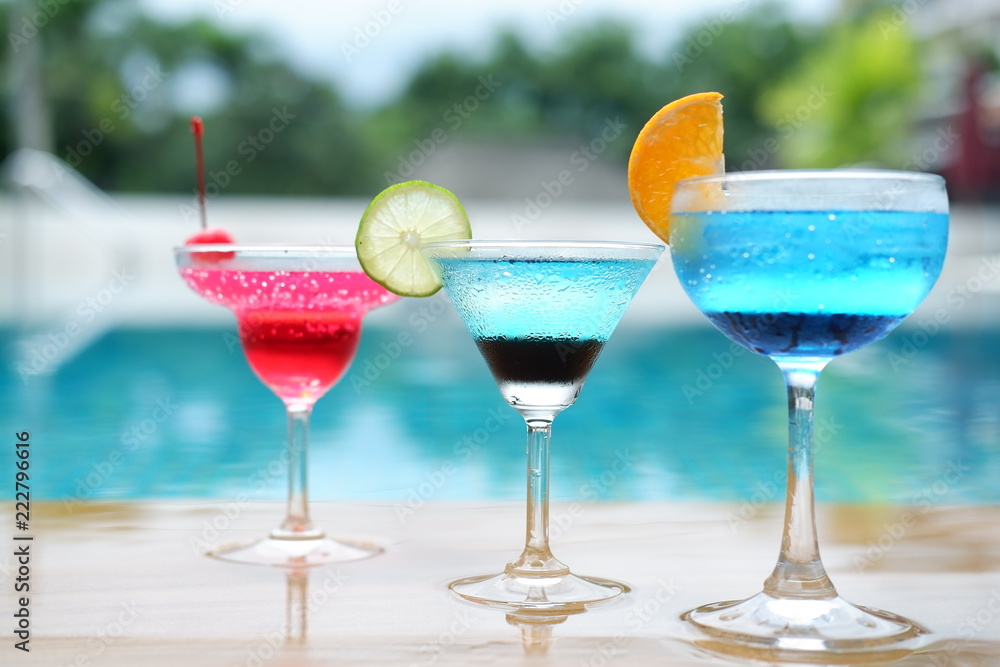 summer alcoholic drinks and cocktails at poolside bar