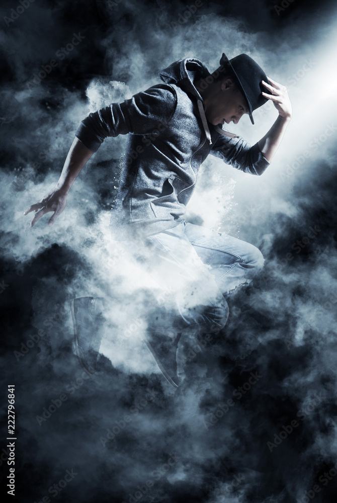 Fototapeta premium Man break dancing on smoke background