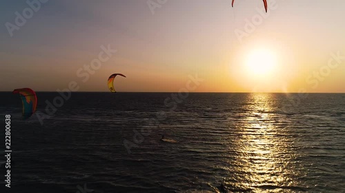 Bright training kites in the sky at sunset, aerial shooting. Slow motion photo