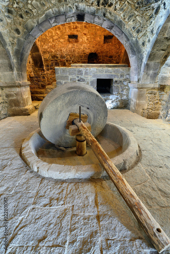 Armenia, Tatev monastery is a 9th century historical monument. Stone wheel for the production of oil. photo