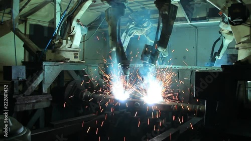Welding robots movement in a car factory, automotive parts industry