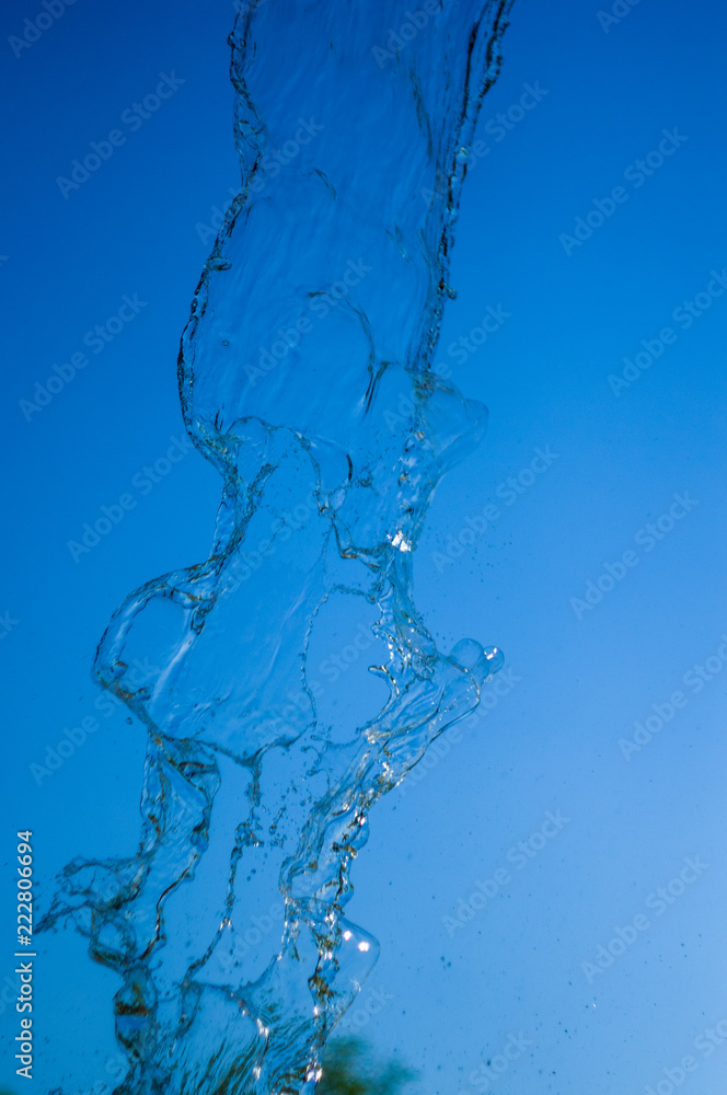 transparent falling water vertical flows, close up