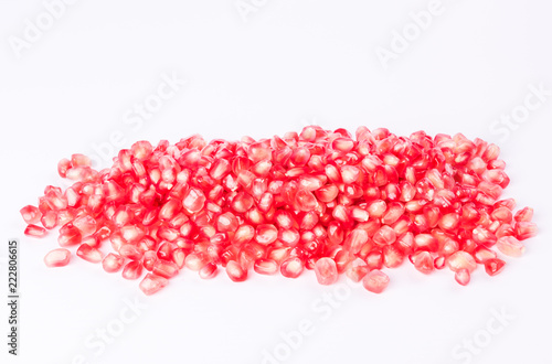 Pomegranate - fresh fruit seeds on white background