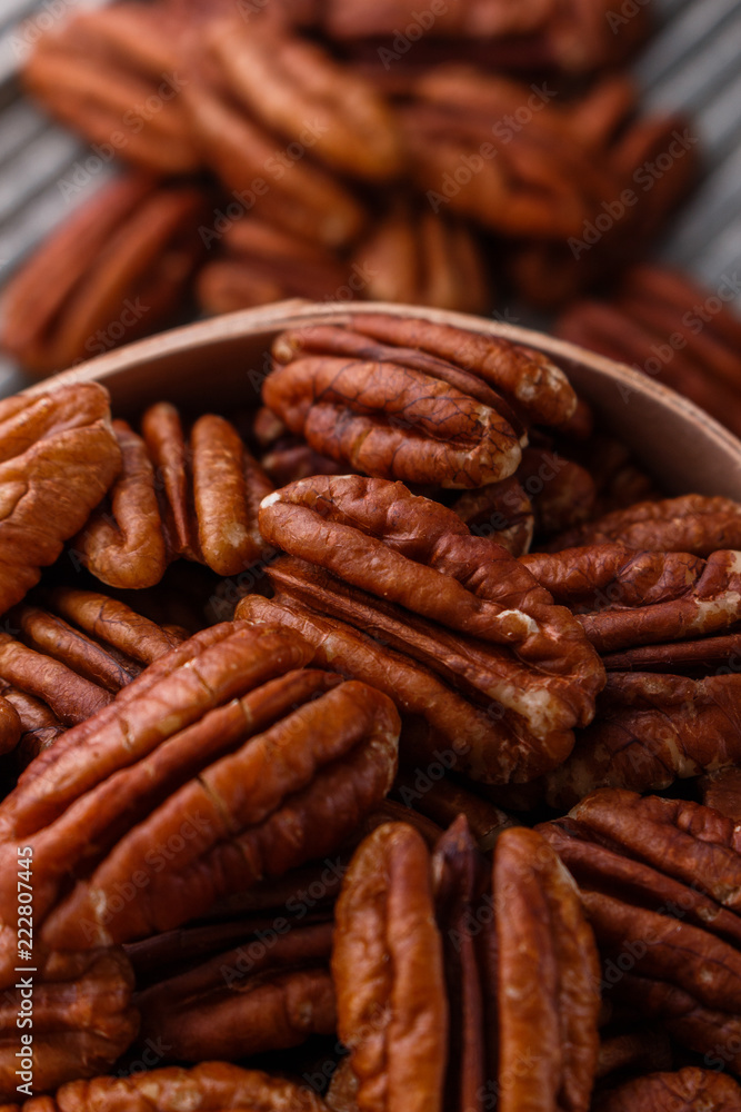 delicious pecan nuts on a rustic wooden background delicious pecan nuts on a rustic wooden background