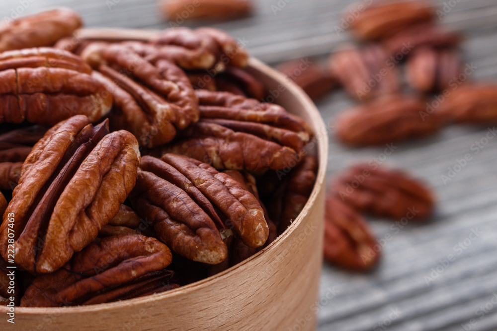 delicious pecan nuts on a rustic wooden background delicious pecan nuts on a rustic wooden background