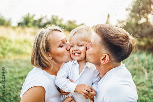 Young family with little son have fun outdoor